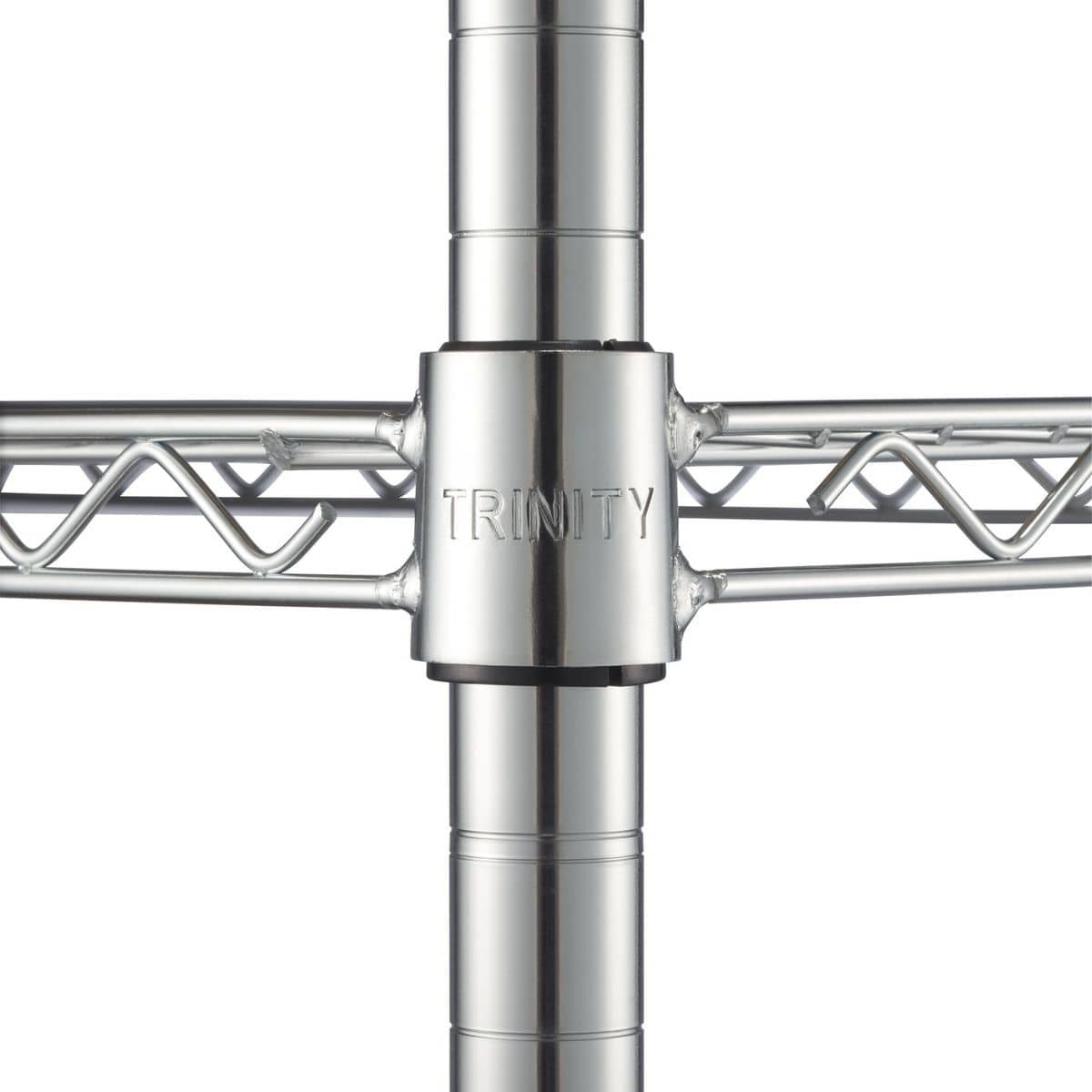 A close-up shows the central connecting piece of a chrome wire shelving unit. The word "TRINITY" is embossed on the cylindrical connector where the horizontal shelf supports meet the vertical poles.