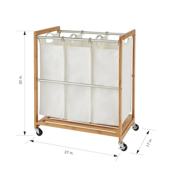 A bamboo-framed, rolling laundry hamper with three cream-colored, removable canvas bags. The dimensions are visible on the image: 32 inches high, 27 inches wide, and 17 inches deep.