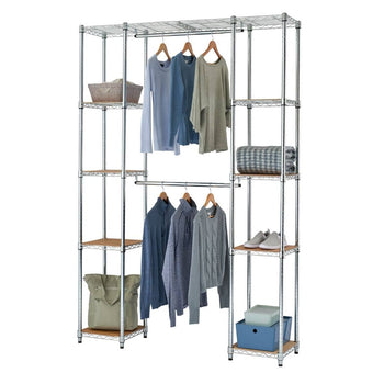 A chrome wire closet organizer with wooden shelves is shown against a white background. It features multiple shelves holding folded blankets, baskets, and storage bins, along with two hanging rods displaying various shirts and sweaters.