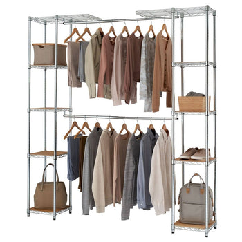 An expanded chrome metal wire shelving unit with two hanging rods functions as an open closet organizer. Various items of clothing are neatly hung on hangers, with shoes, bags, and fabric bins stored on the shelves.