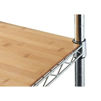 A close-up shot of a chrome wire shelving unit with a light brown bamboo shelf liner on top. The bamboo liner covers the wire rack, creating a smooth, solid surface, and is secured by a metal clip around the vertical chrome pole.