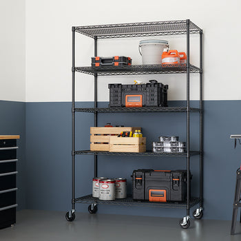 A five-tier, black wire shelving unit with wheels is filled with tools and supplies in a clean garage or workshop. The shelves hold various items including a large gray bucket, plastic storage cases, a wooden crate, and paint cans.