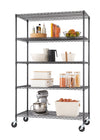 A wire shelving unit on wheels, with five shelves displaying various kitchen items. From top to bottom, the shelves hold a fruit bowl, books, pantry containers, and a stand mixer.
