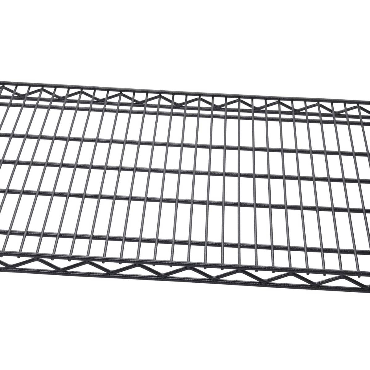 A close-up shows a section of a black, wire shelving unit. The grid pattern of the shelf is clearly visible, highlighting its open design.
