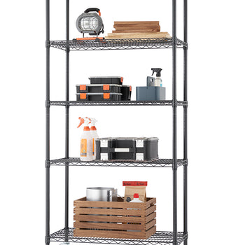 A tall, five-tier black wire shelving unit with casters holds various items, suggesting use in a garage or utility space. Contents include wood planks, toolboxes, spray bottles, and a large wooden crate with metal and paper items.