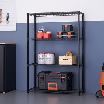 A four-shelf black wire rack is set up in a garage, holding various items like tools, paint cans, and storage bins. To the left is a black metal cabinet with a wood countertop, and to the right is a large orange and black shop vacuum.