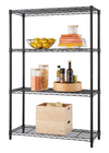 A four-tiered, black wire shelving unit is shown against a white background. The shelves are organized with various items, including bowls of lemons, a stack of cookbooks, glass containers of food, and two wooden boxes.