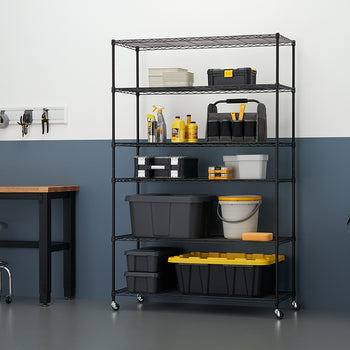 A tall, black wire shelving unit on wheels is fully stocked with various black and yellow storage containers, tools, and cleaning supplies in a clean, organized garage or workshop setting. The shelving unit is positioned against a two-toned wall (light gray above, dark blue below) next to a dark wood workbench with a metal stool.