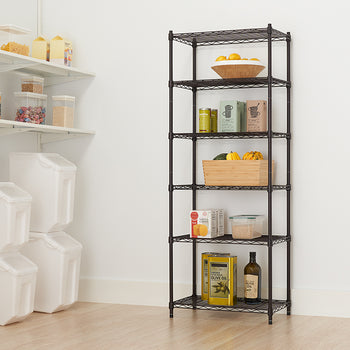 A tall, narrow, wire shelving unit is placed in a corner, stocked with various pantry items like produce, canned goods, boxed foods, and oils. To the left, there are white wall-mounted shelves and large plastic storage containers, suggesting this is a well-organized pantry or storage area.