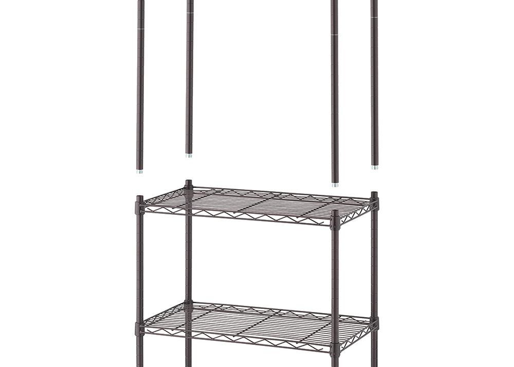 A two-tiered, partially assembled metal wire shelving unit in a dark bronze color. Four separate poles for the upper part of the shelving unit are visible above the assembled lower section.