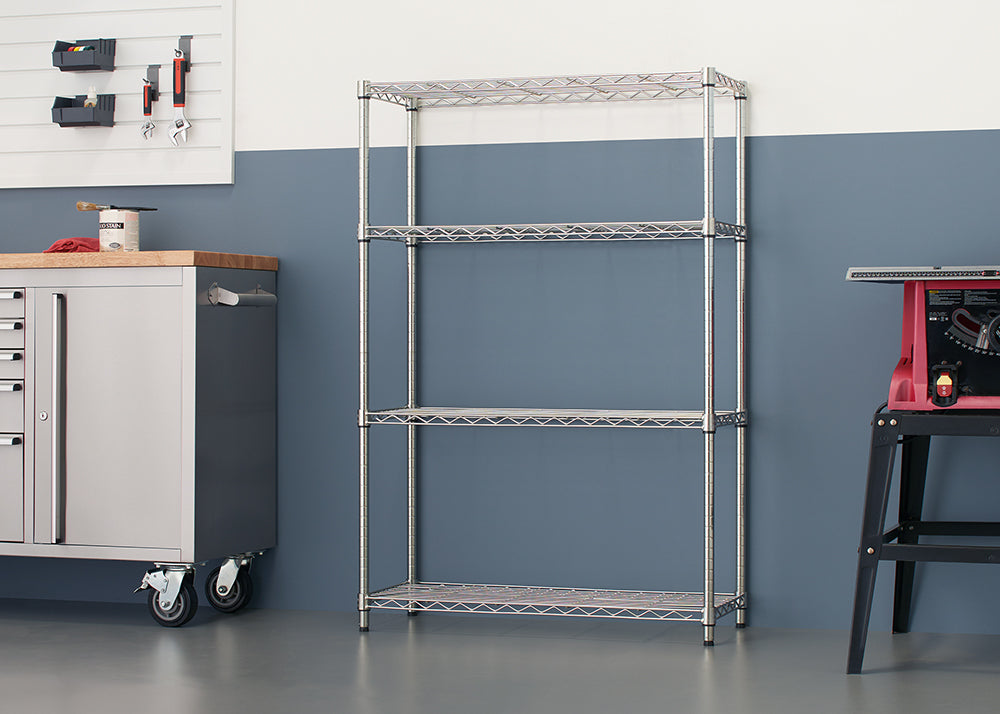 
A shiny, four-tier chrome wire shelving unit stands against a blue and gray wall. The empty shelves are ready for storage in what appears to be a garage or workshop setting.