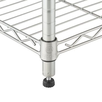 A close-up of the bottom corner of a stainless steel wire shelving unit. The adjustable leveling foot is visible at the base of the pole, while the wire shelf is secured to the pole with a black plastic clip.