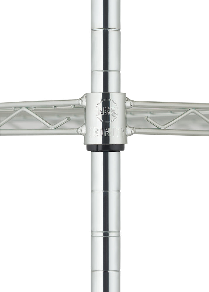 
A close-up, centered shot of a chrome wire shelving unit shows the joint where two horizontal shelves meet a vertical pole. The circular connection sleeve is engraved with the NSF certification mark and the brand name TRINITY.