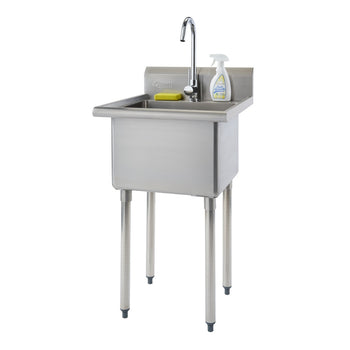 A freestanding stainless steel utility sink with a single bowl, a chrome gooseneck faucet, and four cylindrical legs with gray non-slip feet is shown against a white background. A yellow sponge and a white spray bottle of cleaning solution rest on the sink's backsplash.