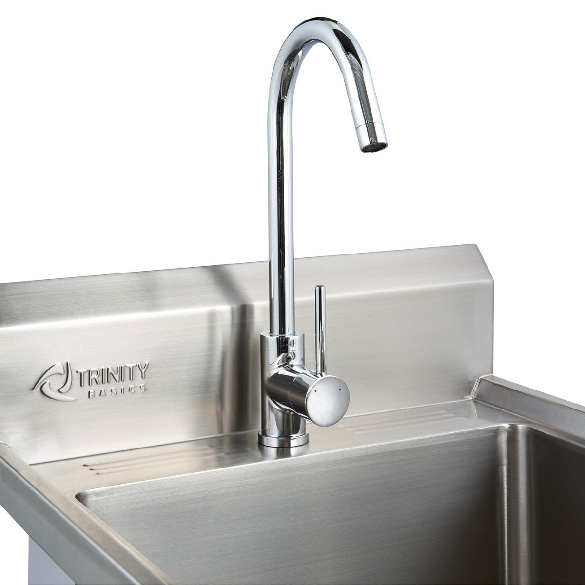 A close-up shot shows a stainless steel utility sink with a chrome gooseneck faucet. The "TRINITY basics" logo is subtly embossed on the backsplash.