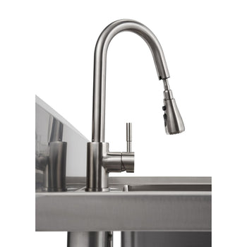 A close-up shot shows a stainless steel utility sink with a tall, curved pull-out faucet. The faucet has a lever handle and a spray nozzle that extends outwards.