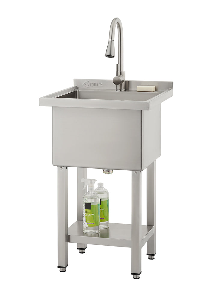 A freestanding stainless steel utility sink by Trinity features a high-arc pull-down faucet and a deep rectangular basin. The unit includes a bottom storage shelf holding cleaning supplies and stands on four adjustable legs.