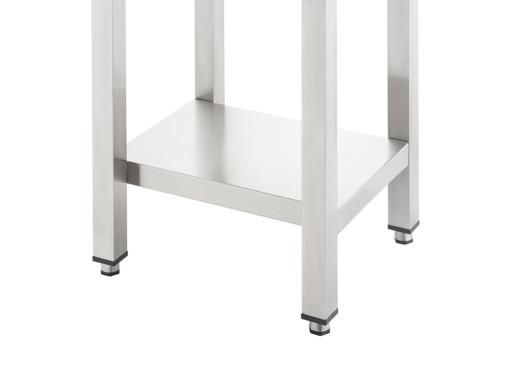 A close-up shot shows the bottom section of a stainless steel utility table featuring four square legs and a lower storage shelf. The legs are equipped with black adjustable leveling feet for stability on uneven surfaces.