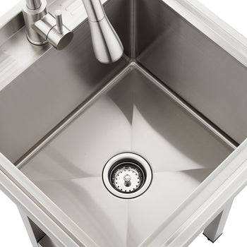 A top-down, angled view of a square, brushed stainless steel utility sink featuring a pull-down faucet and a central drain with a strainer. The sink basin has visible X-shaped drainage grooves and is branded with the name 