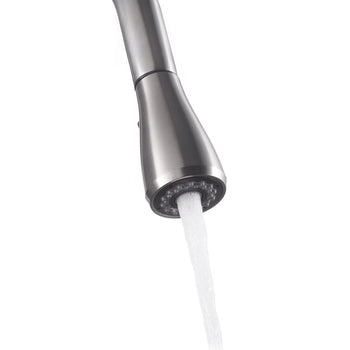 Close-up shot of a stainless steel pull-out faucet head with water flowing out. The faucet features a spray nozzle with multiple openings for the water stream.