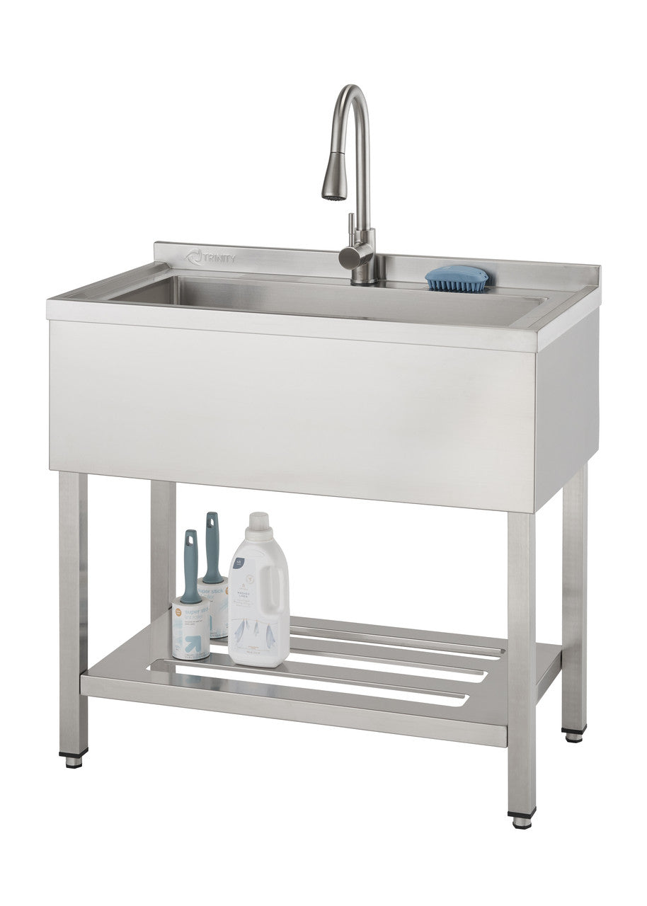 A stainless steel utility sink with a single bowl and a tall, curved faucet is shown against a white background. The sink sits on a stand with a slatted shelf below, holding cleaning supplies.