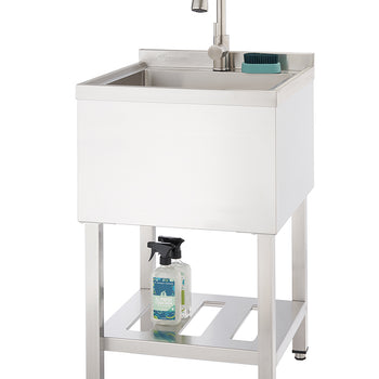 A stainless steel utility sink with a faucet is shown against a white background. The sink stands on four legs with an open shelf below, holding two spray bottles.