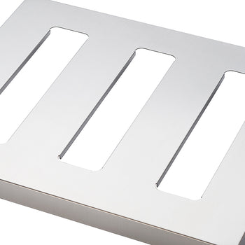 A close-up shot shows a rectangular, brushed metal plate with three elongated, rectangular cutouts running parallel to each other. The cutouts allow visibility of the white background behind the plate.