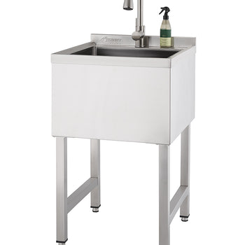 A freestanding utility sink made of brushed stainless steel features a gooseneck faucet and a small bottle of soap on its right edge. The sink stands on four sturdy square legs with adjustable feet, set against a plain white background.