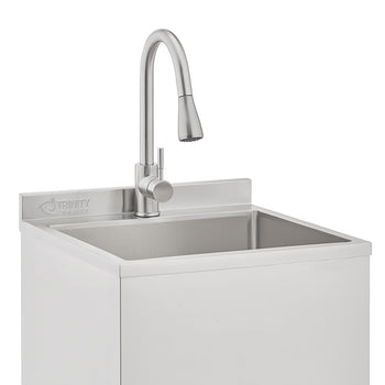 A close-up of a Trinity Basics stainless steel utility sink featuring a high-arc, pull-down swivel faucet with a brushed nickel finish. The unit includes a deep rectangular basin and a integrated backsplash embossed with the brand logo.