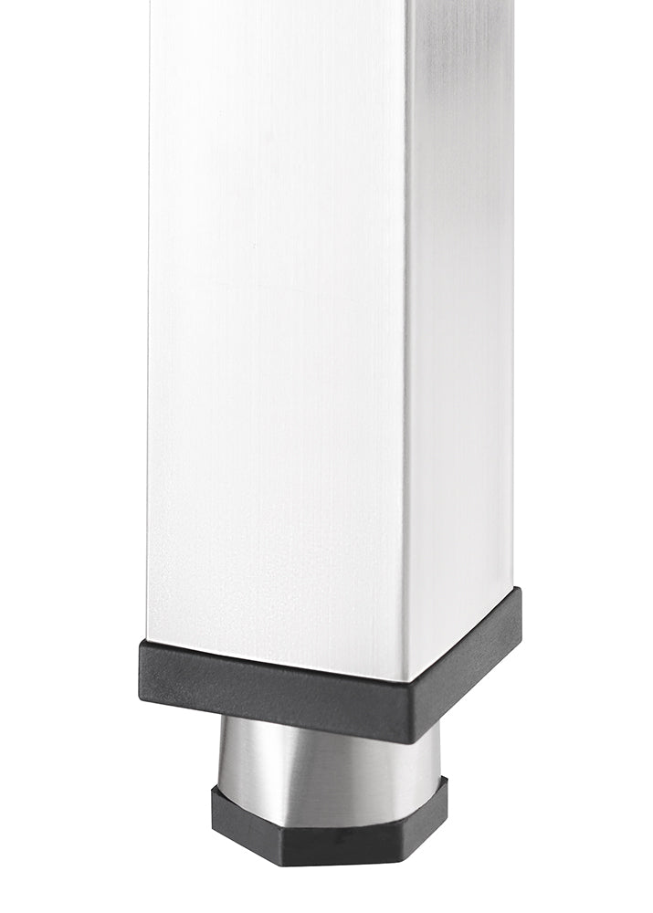A close-up shot shows the bottom of a brushed metal square table leg, featuring a black plastic foot with a tapered silver tip.