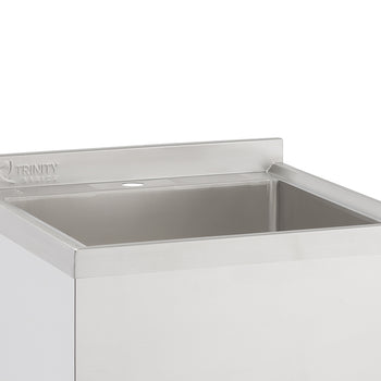 A close-up shot shows the top portion of a stainless steel utility sink. The sink features a rectangular basin and a backsplash with the 
