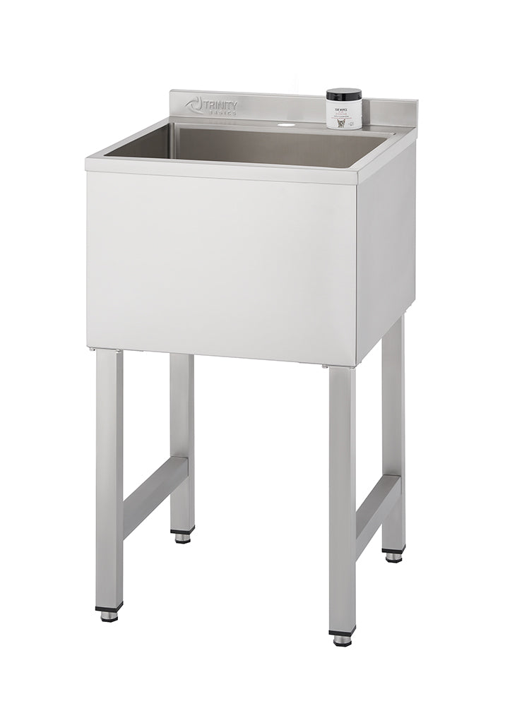 A close-up, studio shot shows a stainless steel utility or commercial prep sink manufactured by TRINITY PRO, standing on four square legs with adjustable feet. A small jar labeled "Mr. WIPE" is resting on the ledge behind the single, deep basin.