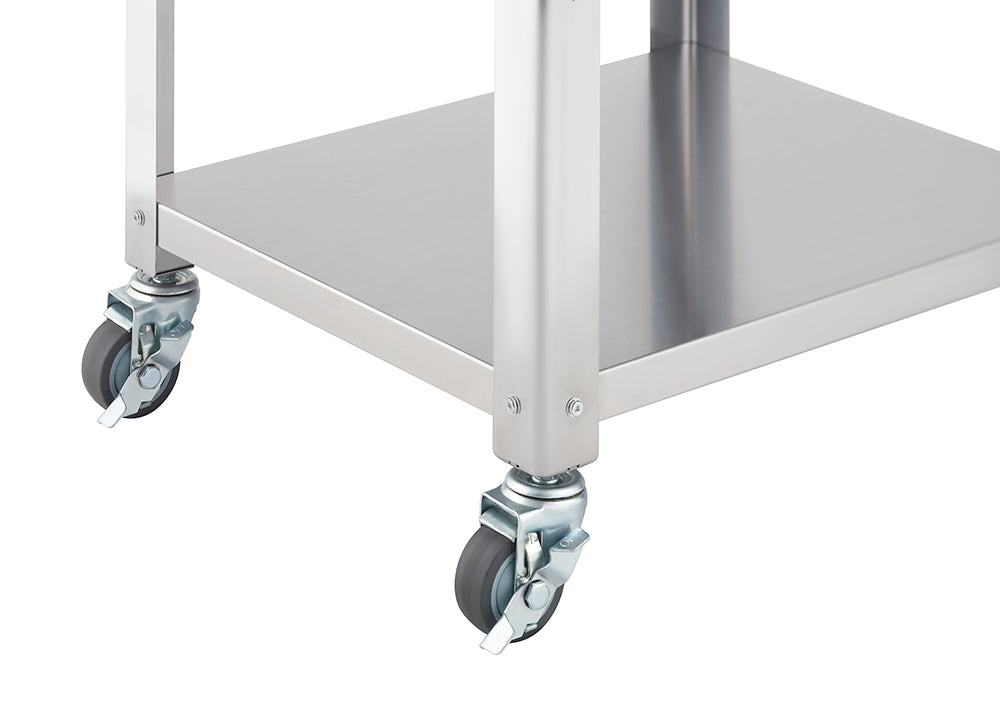 A close-up shot of the bottom corner of a stainless steel kitchen cart, showing two caster wheels and part of a stainless steel shelf. The wheels are gray with metal hardware and the shelf has a smooth, reflective surface.