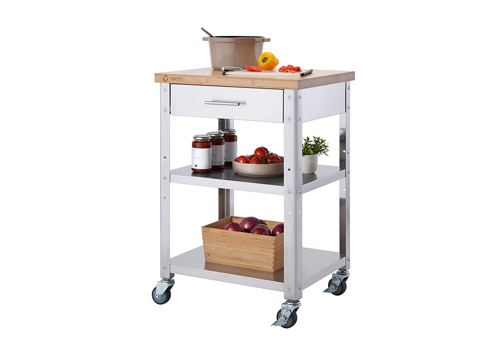 A stainless steel kitchen cart with a light wood butcher block top is shown on a white background. The cart features a drawer, two shelves, and four caster wheels, with various kitchen items staged on the top and shelves.