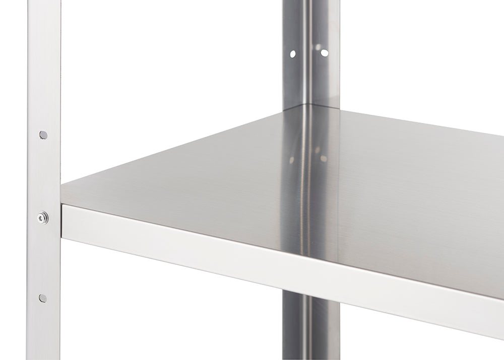 A close-up shot of a metal shelf corner, showing a flat, silver shelf resting on a white metal frame. The frame has visible holes for adjustable shelf height.