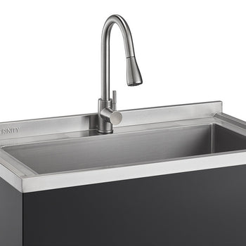 A close-up shot of a stainless steel utility sink with a pull-out faucet, featuring the 