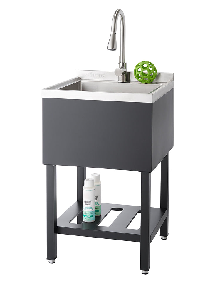 A modern, freestanding utility sink with a stainless steel basin and a black cabinet. The sink features a single-handle gooseneck faucet and a lower shelf holding two white bottles.