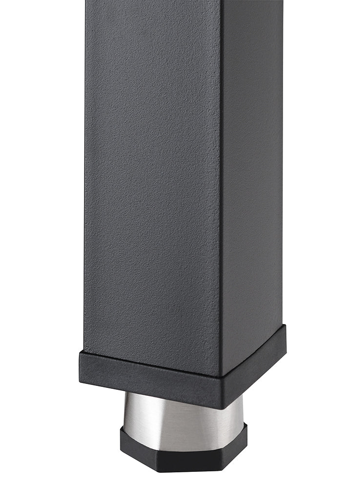 A close-up shot shows the bottom of a matte black, rectangular table leg. It features a brushed metal foot that tapers slightly and is capped with a black, slightly angled base.