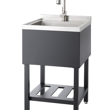 A utility sink with a brushed metal faucet stands on a dark gray metal frame with a slatted shelf at the bottom. The sink basin is stainless steel, and the cabinet surrounding it is a black matte.