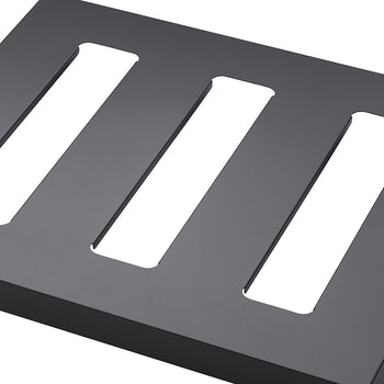 A matte black rectangular object with three elongated, rectangular shelf is shown from an angled, close-up perspective.