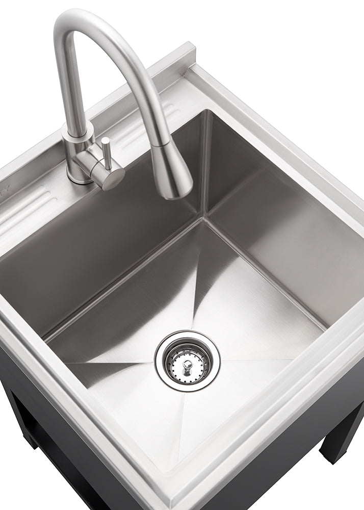 A top-down view shows a modern utility sink made of stainless steel, featuring a single basin with a drain at the center. A gooseneck faucet in a brushed metal finish is mounted on the back edge of the sink, ready for use.