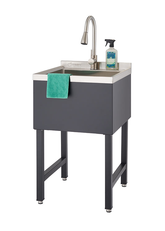 A freestanding black utility sink with a stainless steel basin and a brushed nickel gooseneck faucet is shown. A green dishcloth hangs over the front edge of the basin, and a spray bottle of cleaner sits on the back right corner of the sink.