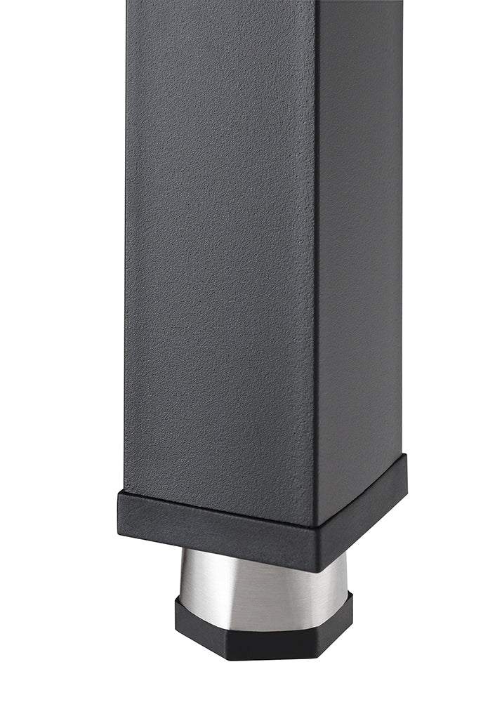 A close-up shot shows the bottom of a black, square table leg with a subtle textured finish. It rests on a short, brushed metal foot that is slightly wider than the leg, with a black, tapered base.