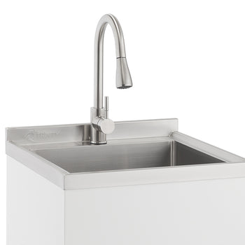 A close-up shot shows a modern utility sink with a brushed stainless steel finish. The sink is integrated into a white cabinet, and a gooseneck faucet with a pull-down spray head is mounted to the back.