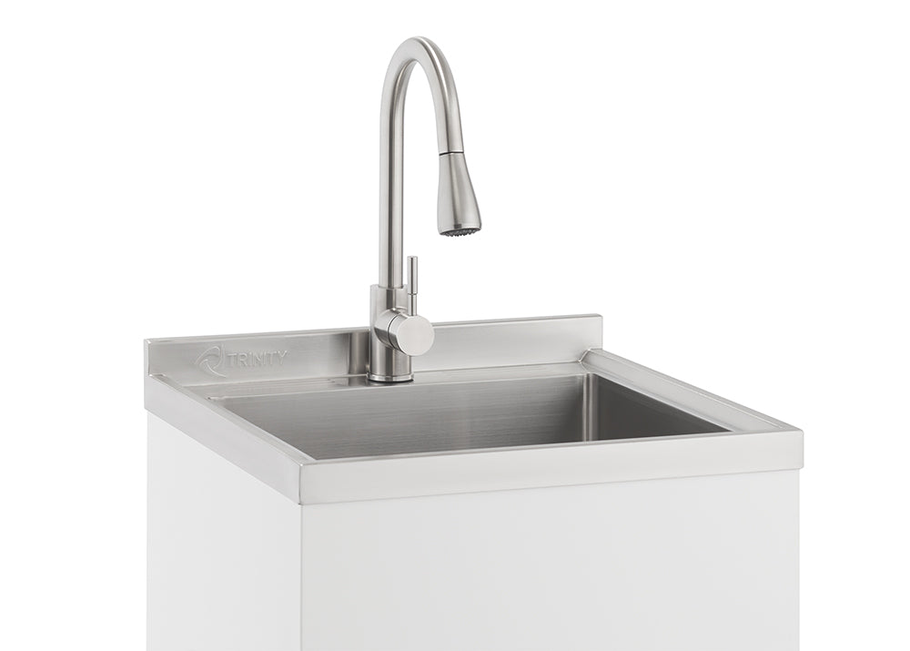 A close-up shot shows a modern utility sink with a brushed stainless steel finish. The sink is integrated into a white cabinet, and a gooseneck faucet with a pull-down spray head is mounted to the back.