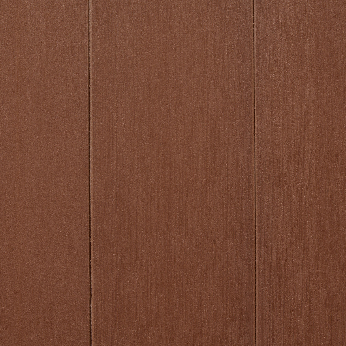 A close-up shows a textured brown surface divided vertically by two thin, darker lines. The material appears to be ridged or paneled, suggesting a cladding or storage box exterior.