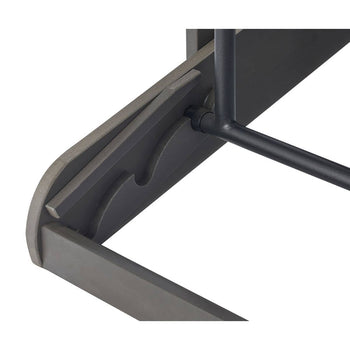 A close-up shows the underside of a dark gray table with rounded edges and a black metal support rod. The table's construction reveals layered wood or composite material, with curved cutouts visible along the inner edge.