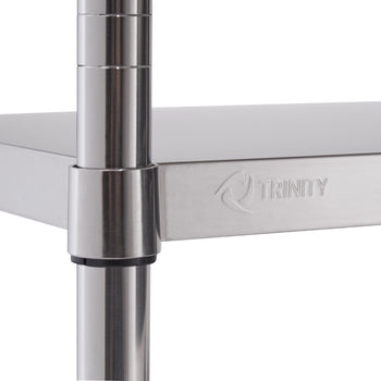 A close-up shows a shiny, stainless steel shelf connected to a round, metallic pole. The word 