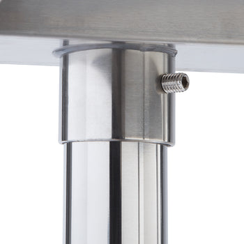 A close-up shot of a stainless steel table leg extending upwards to meet the underside of a tabletop. A small screw is visible on the side of the leg, likely used for adjustment or securing the components.