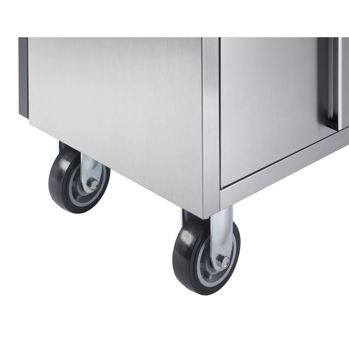 Close-up view of the bottom corner of a stainless steel workbench, showing two black caster wheels with gray centers. The polished metal surface of the workbench reflects some light.